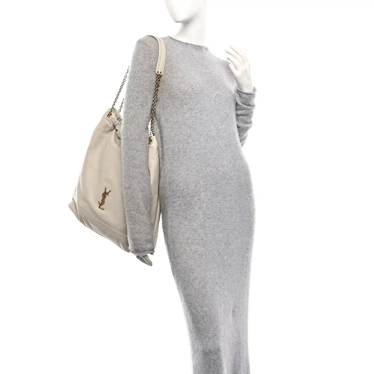 Cream lambskin tote bag with chain handle and YSL logo, draped side view