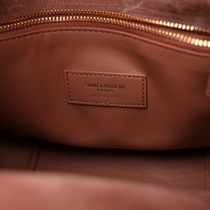 Small suede hobo bag interior with leather trim and stitched brand label