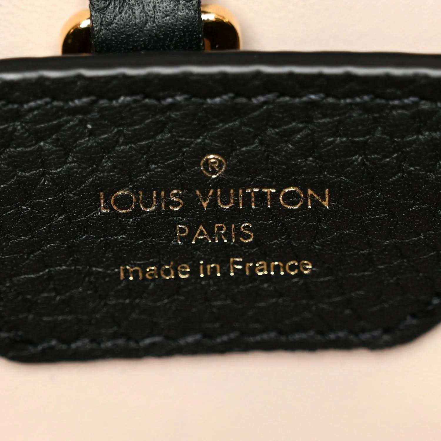 Black leather handbag brand patch with gold Louis Vuitton Paris text