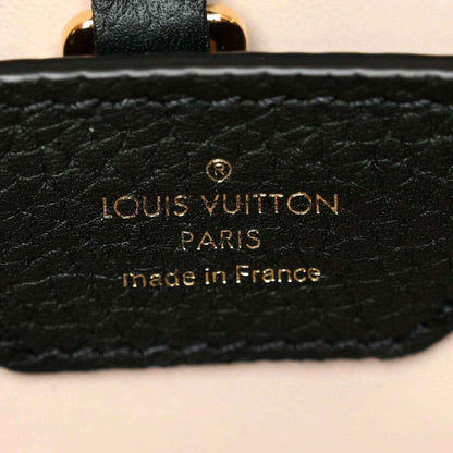 Black leather handbag brand patch with gold Louis Vuitton Paris text