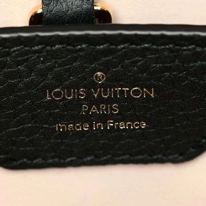 Black leather handbag brand patch with gold Louis Vuitton Paris text