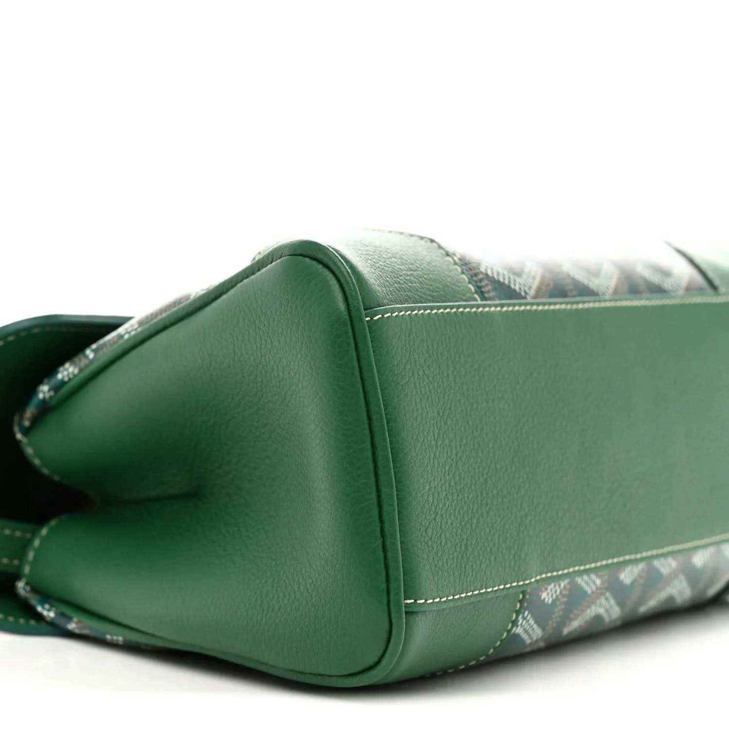 Green mini Saigon bag corner with rounded edge, chevron canvas base, and strap attachment