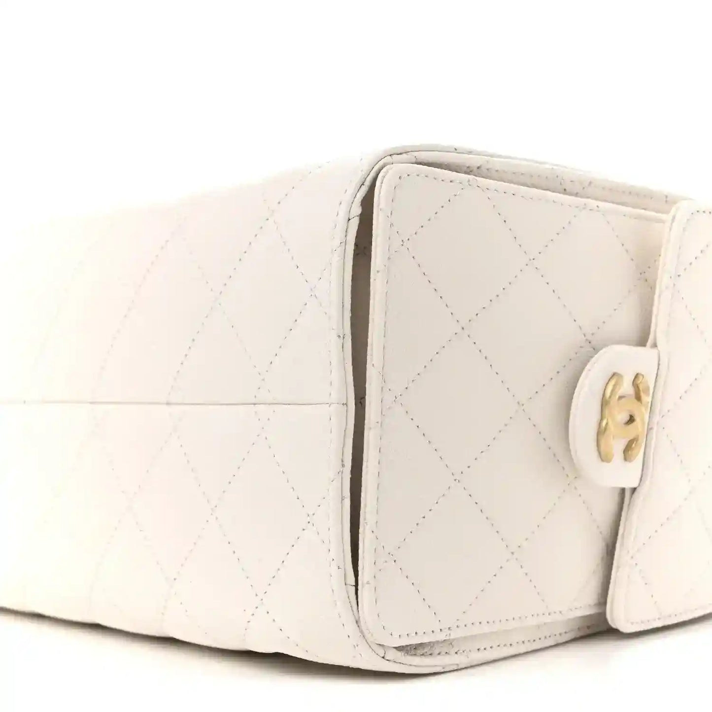 White quilted caviar leather handbag with gold-tone clasp and side profile