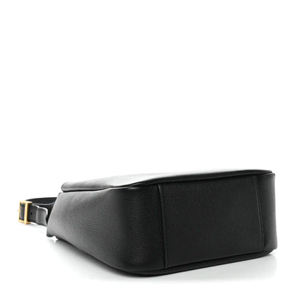 Black calfskin hobo bag with crossbody strap attachment and gold-tone buckle.