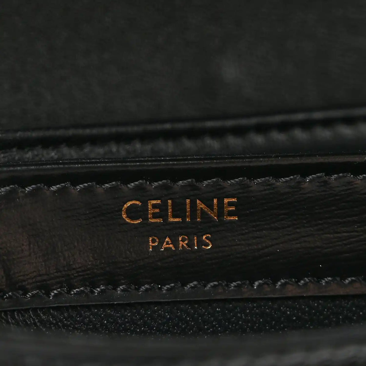 Black leather mini crossbody bag with gold-tone “CELINE PARIS” logo stamp