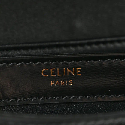 Black leather mini crossbody bag with gold-tone “CELINE PARIS” logo stamp