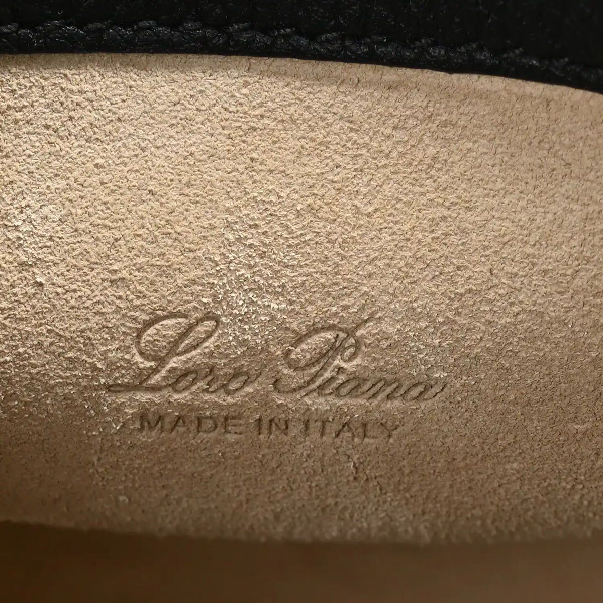 Micro bale bag interior stamp text on tan leather lining