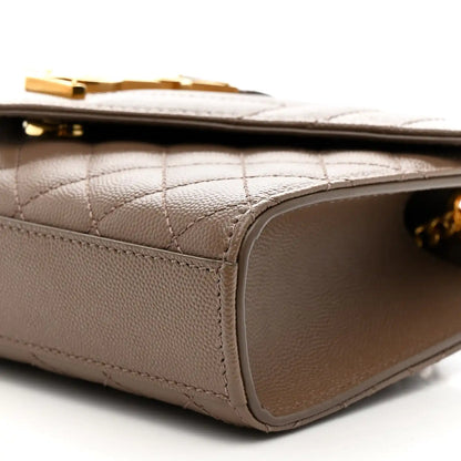 Dark beige quilted satchel side with stitched trim and curved leather edge