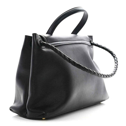 Black leather medium shoulder bag with braided strap and side view of the open top.