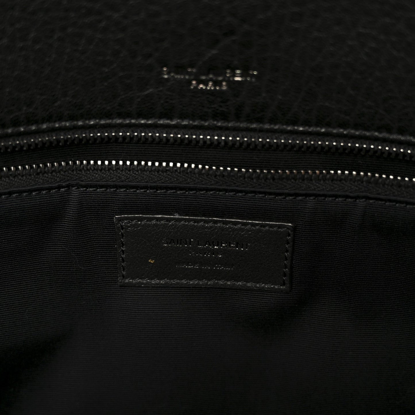 Black leather satchel interior logo label with dual zipper track