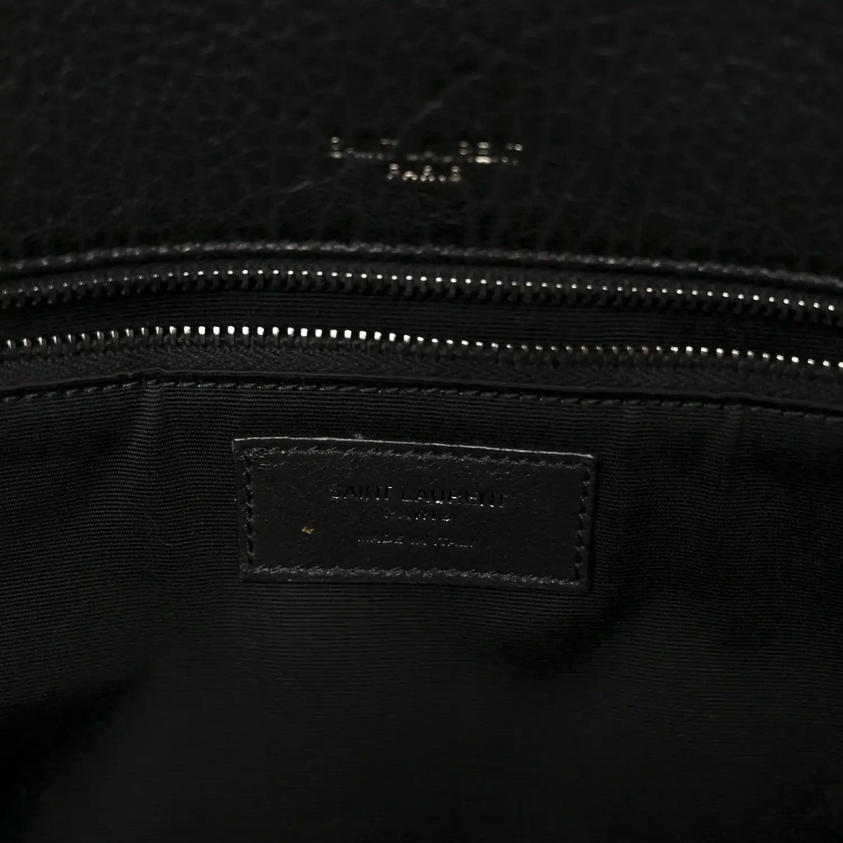 Black leather satchel interior logo label with dual zipper track
