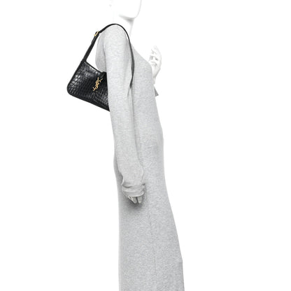 Black crocodile-embossed hobo bag worn on a mannequin, front view.