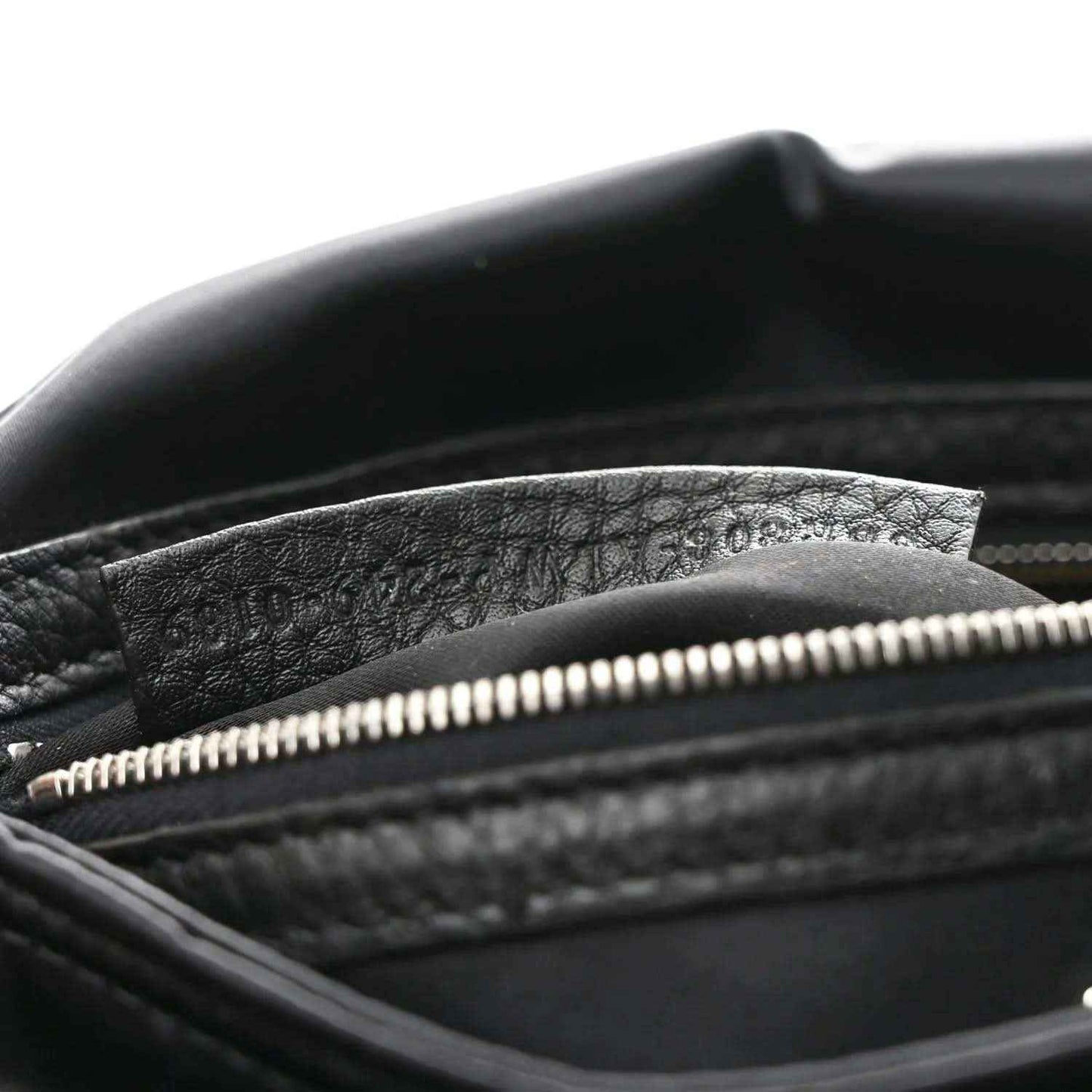 Fendi Econyl black nylon bag showing top zipper and textured inner lining