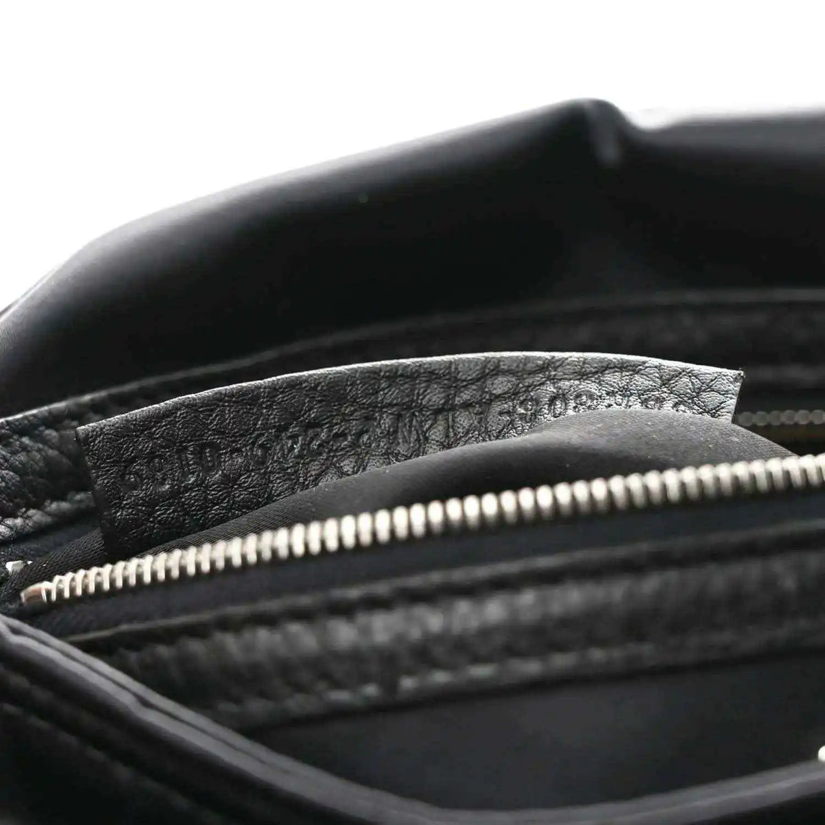 Fendi Econyl black nylon bag showing top zipper and textured inner lining