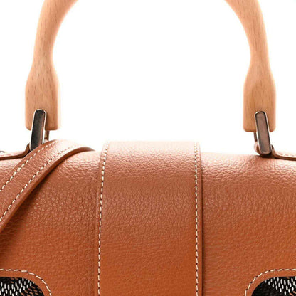 Mini Saigon shoulder bag top handles with metal hardware and stitched leather sections