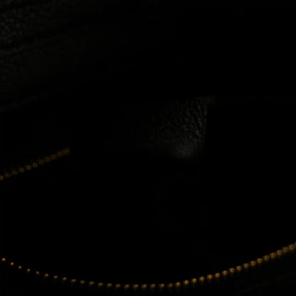 Black interior with gold-trim zipper opening