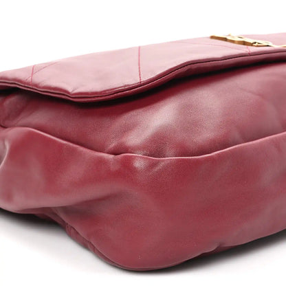 Dark bordeaux lambskin shoulder bag corner with quilted stitching and flap edge