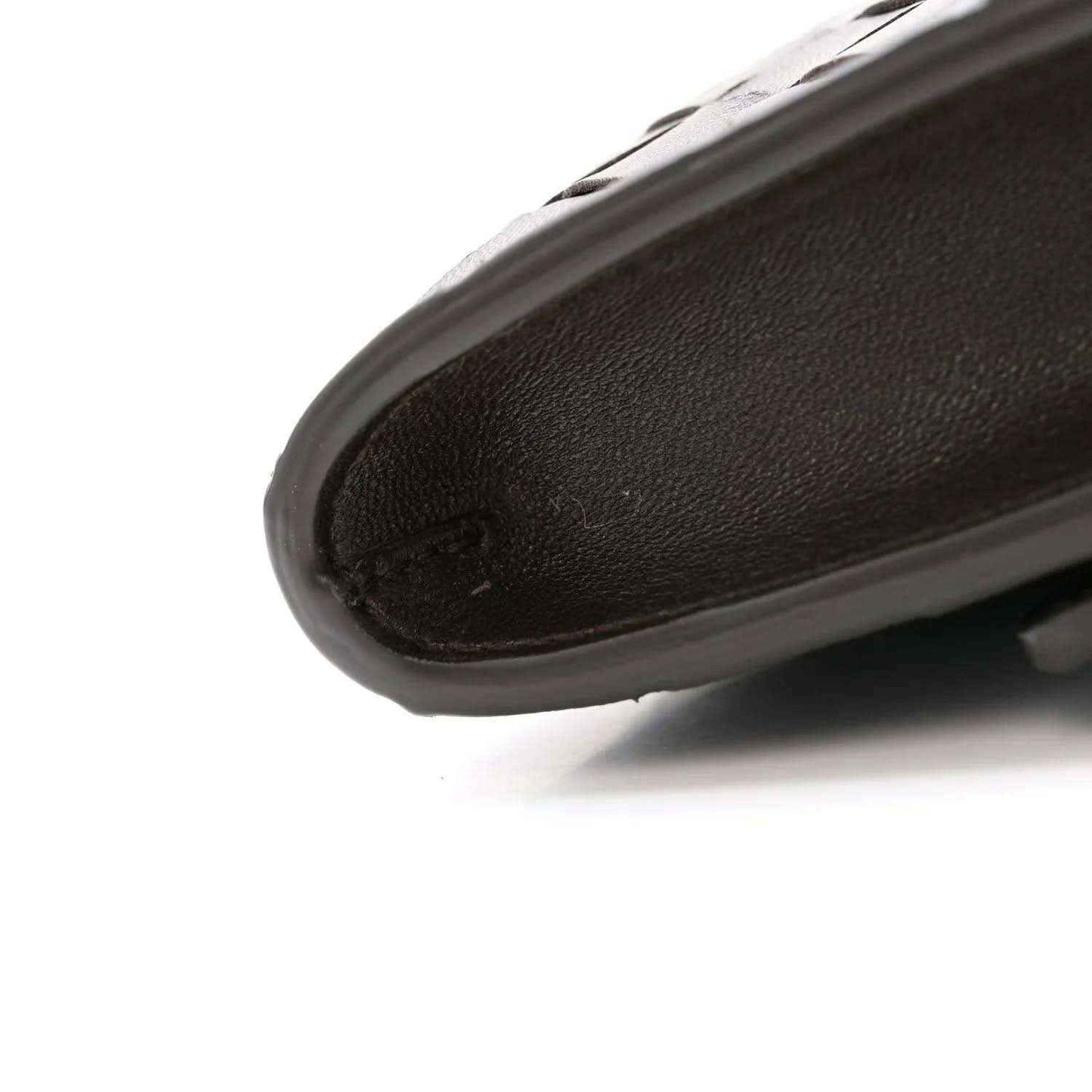 Nappa leather clutch corner with rounded edge and stitched trim, dark tone