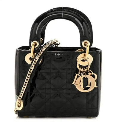 Black patent mini Lady Dior handbag with top handles, chain strap, and gold hardware