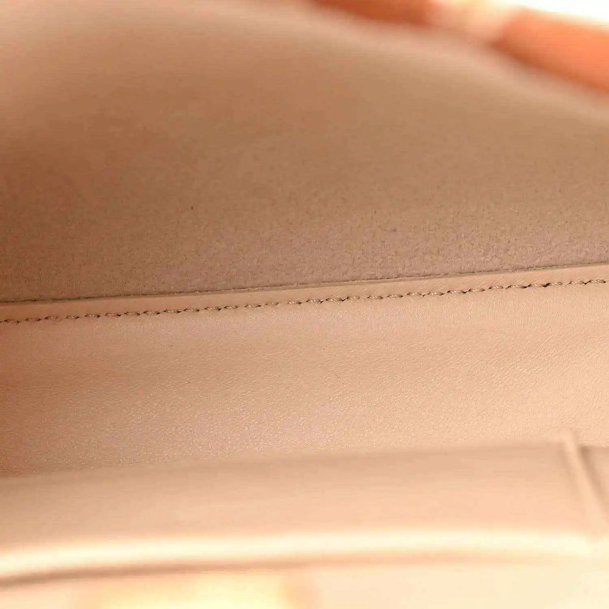 Mini Peekaboo satchel interior lining and stitched seam in light beige