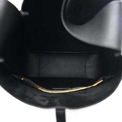 Black leather hobo bag interior view with gold chain edging along the opening