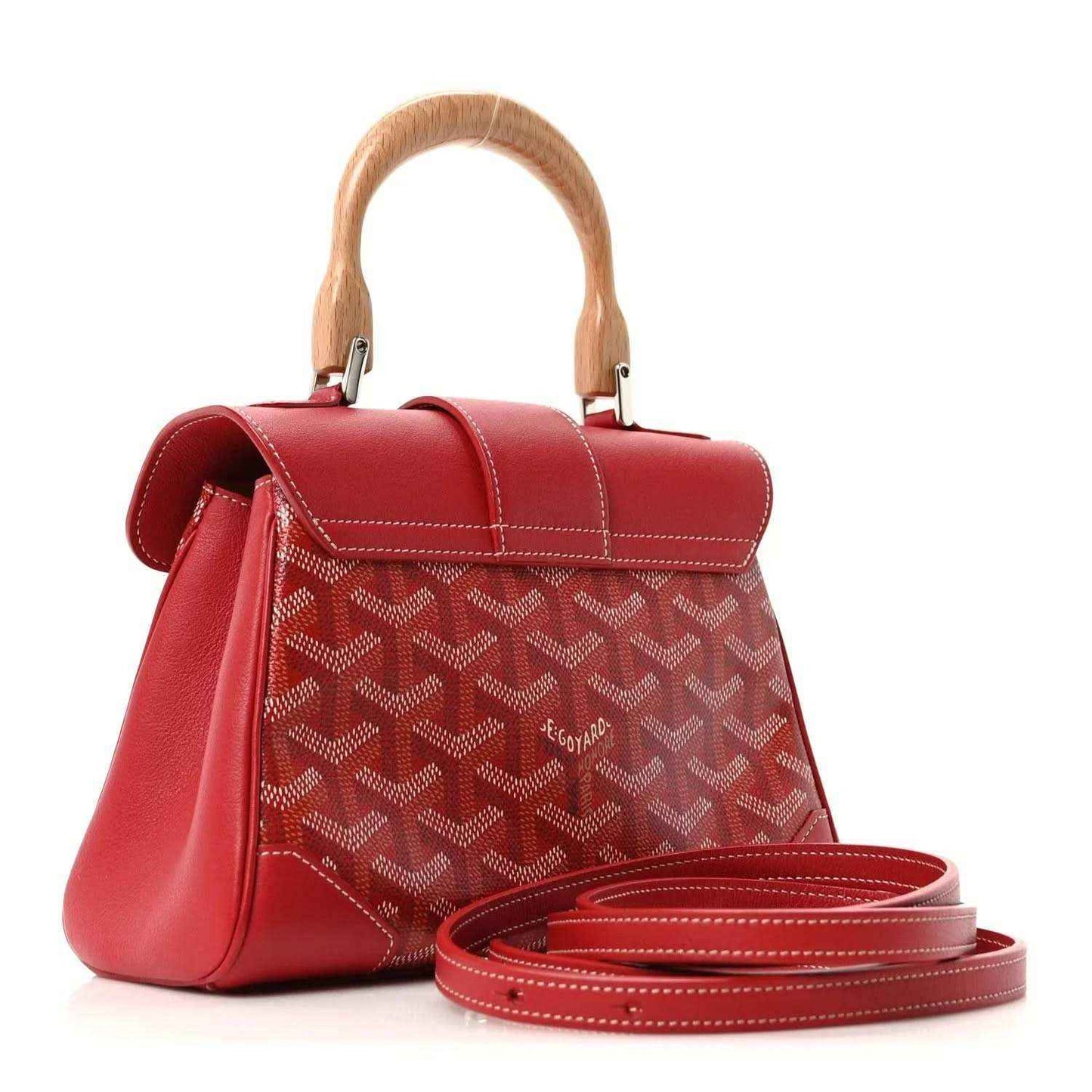 Red mini handbag with top handle, flap, patterned coated canvas, and crossbody strap.