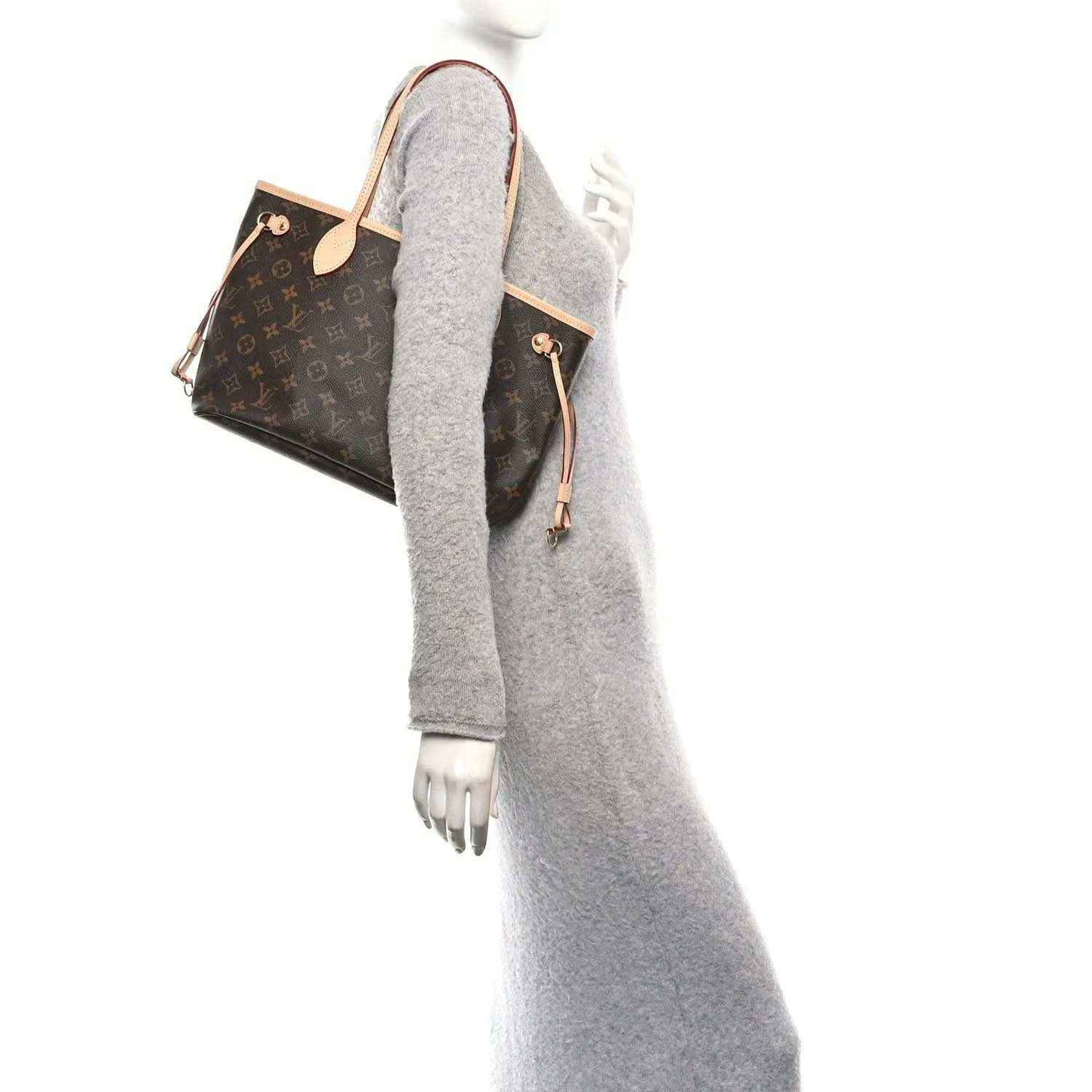 Louis Vuitton monogram canvas tote bag shown side profile with leather handles
