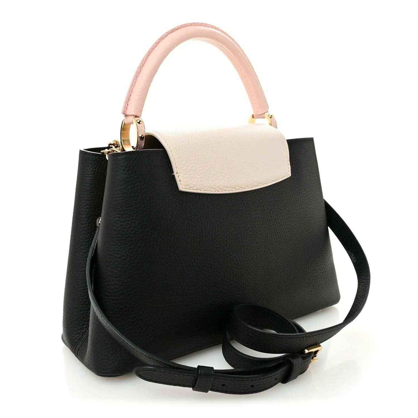 Black leather handbag with light cream top panel, pink handle, and black shoulder strap