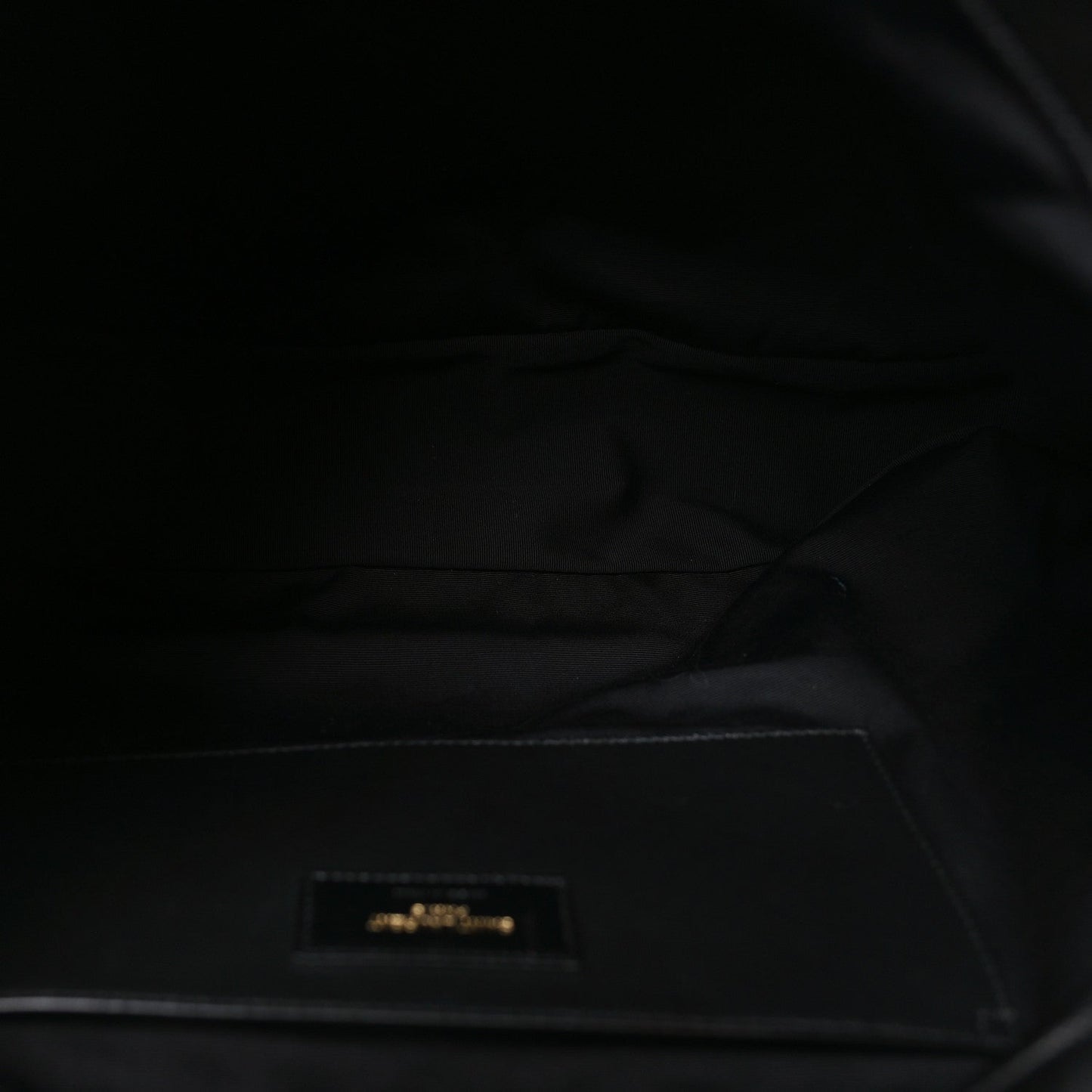 Saint Laurent black lambskin interior lining with zipper opening and small logo tag