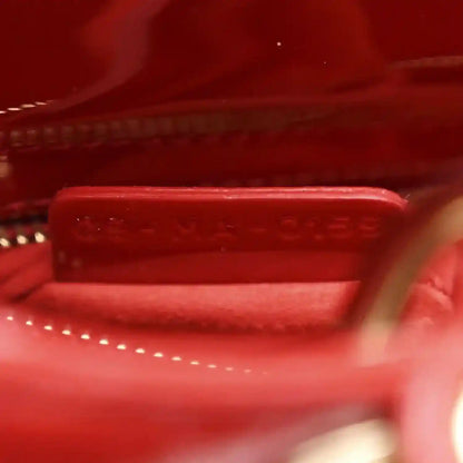 Christian Dior small red patent quilted handbag, close-up of interior panel and stitching