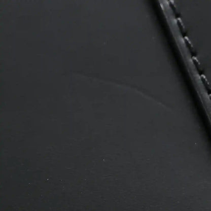Black textured leather handbag with stitched edge and dark trim