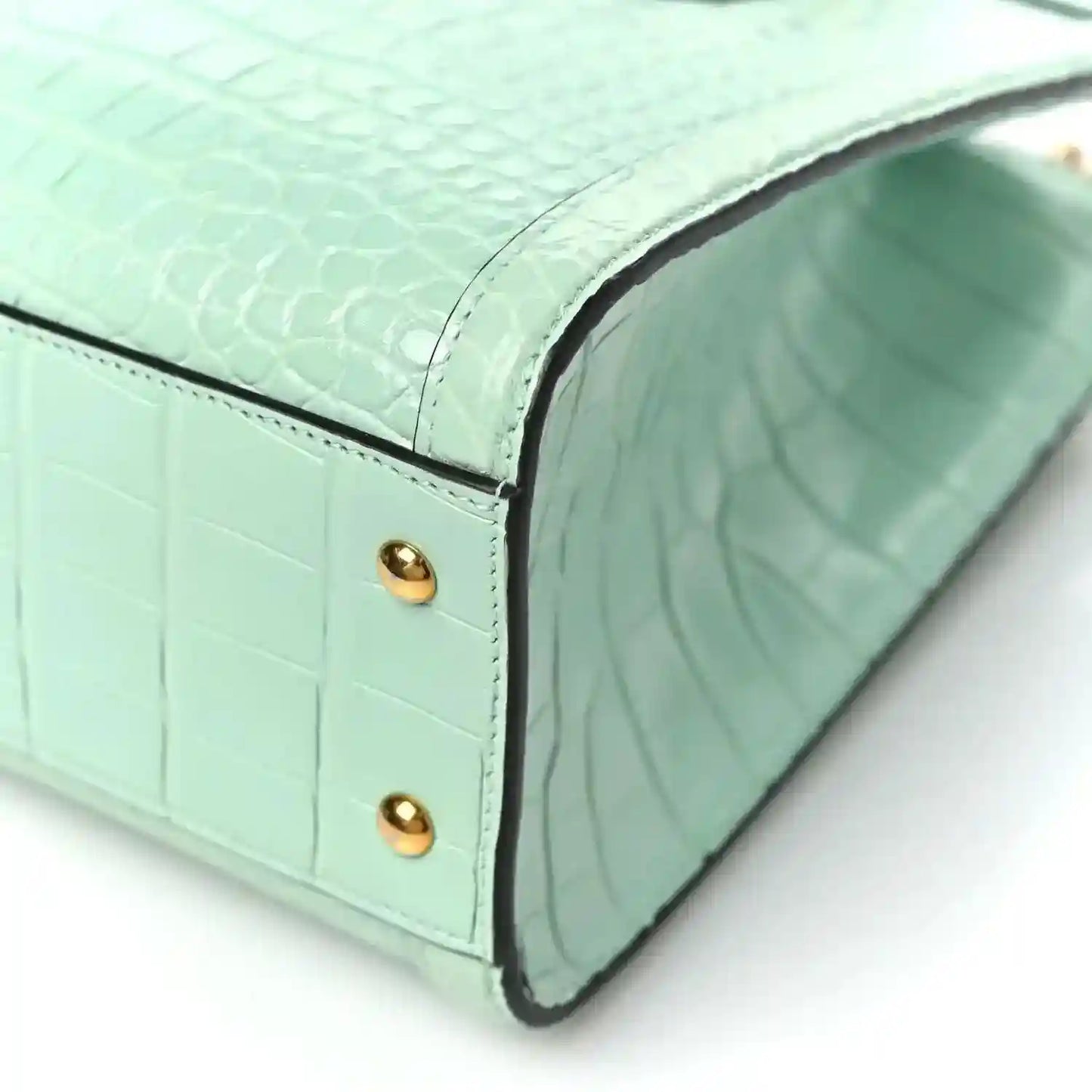 Green alligator-embossed small tote bag with bamboo handles and gold stud detail