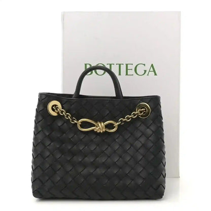 Black intrecciato nappa leather small shoulder bag with gold chain detail and top handles