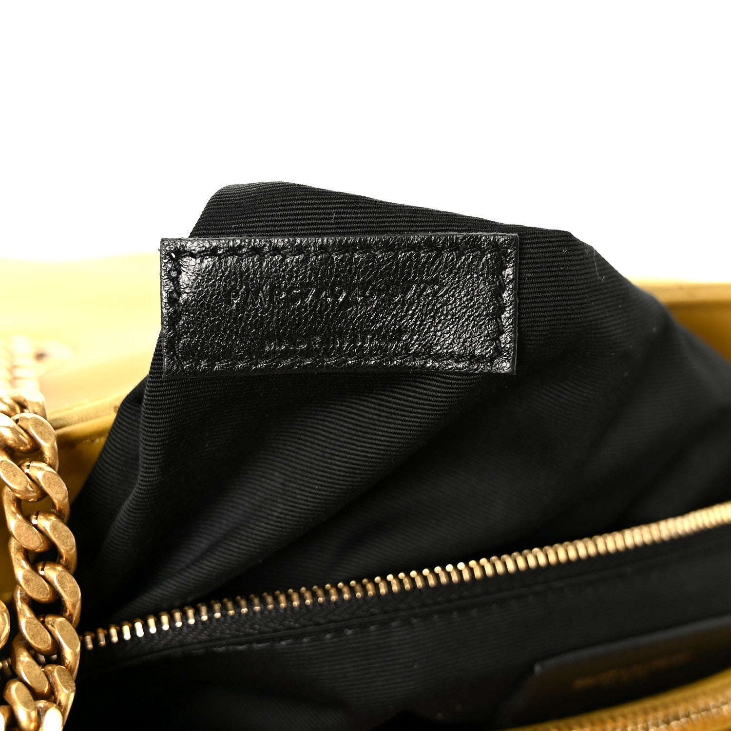 Black fabric interior patch and zipper edge with gold-tone hardware