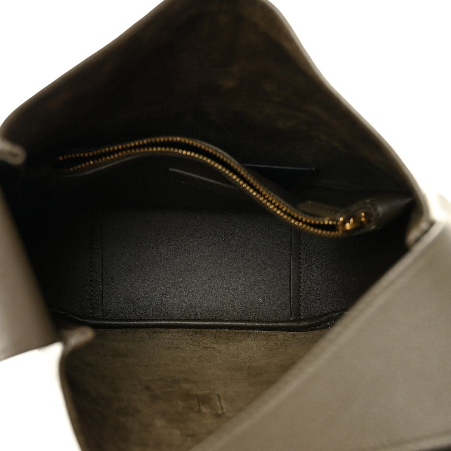 Calfskin hobo bag interior view with dark lining and gold-tone zipper.