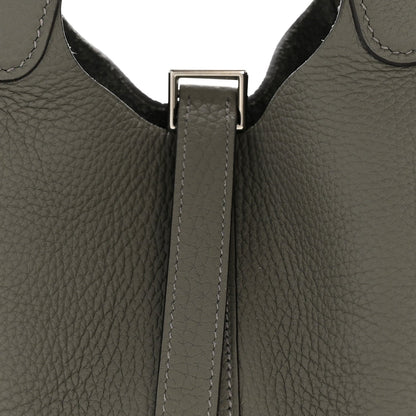 Leather bucket bag top lock strap with silver-toned hardware, dark green