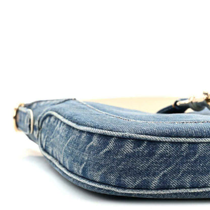 Blue denim Jackie shoulder bag side profile with curved seam stitching