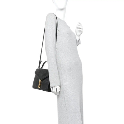 Black crocodile-embossed medium top handle bag with crossbody strap