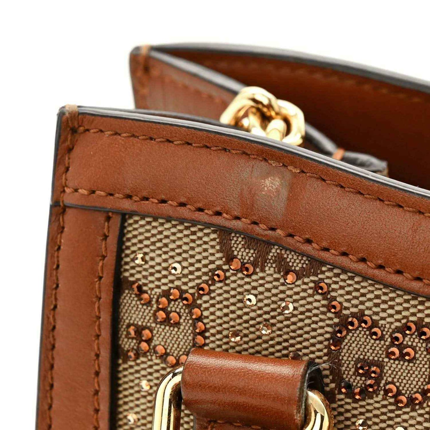 Mini Diana tote bag top edge with brown leather, crystal GG canvas and gold clasp