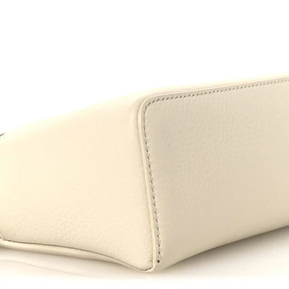 White grained calfskin pouch with stitched corner and rounded bottom edge