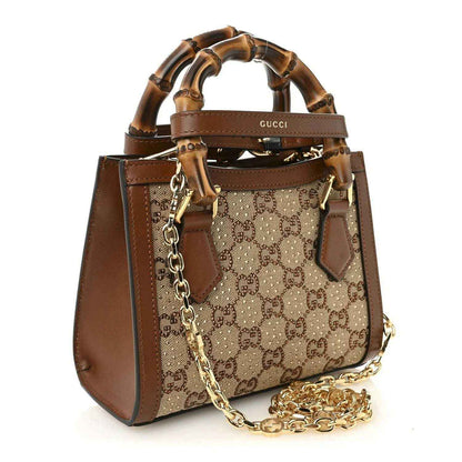 Mini tote bag with GG monogram canvas front, brown leather side panels, bamboo top handles