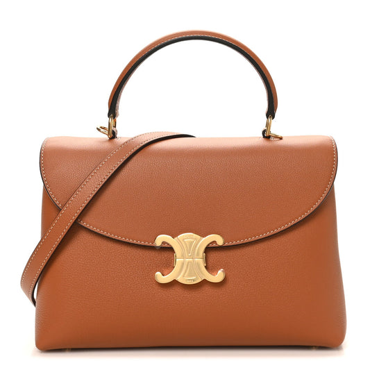 Tan grained calfskin medium handbag with gold logo clasp, top handles, and crossbody strap
