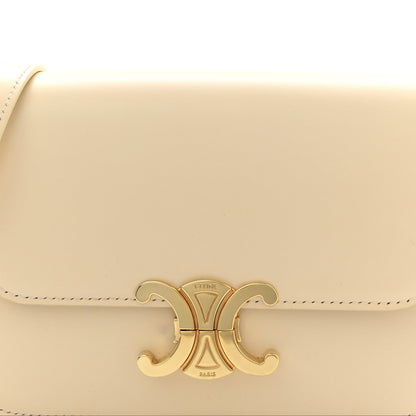 Nude calfskin flap with gold Triomphe logo clasp and stitched edge