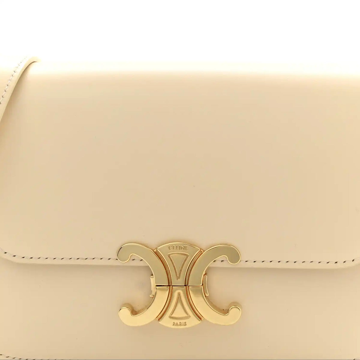 Nude calfskin flap with gold Triomphe logo clasp and stitched edge