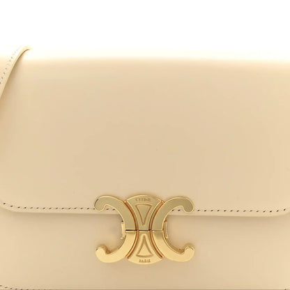Nude calfskin flap with gold Triomphe logo clasp and stitched edge