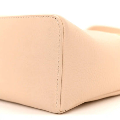 Cream leather pouch base corner with seam and textured grain