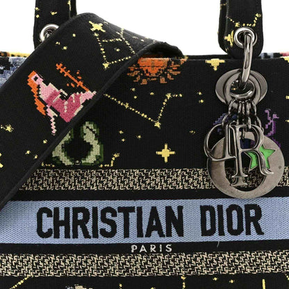 Black embroidered canvas handbag front with Christian Dior PARIS band and silver charm hardware