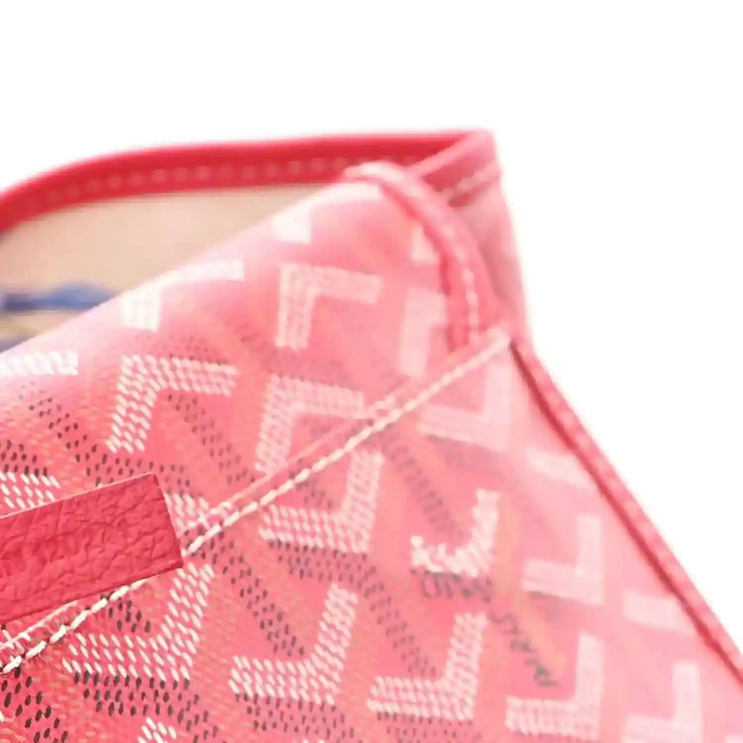 Fuchsia patterned tote bag corner close-up with Goyardine motif and stitched trim