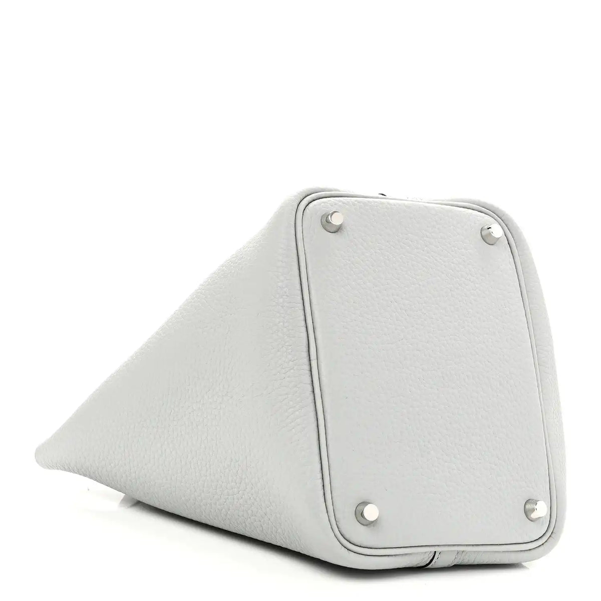 Light blue pebbled leather bucket bag side panel with metal studs and curved base