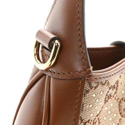 Brown leather mini hobo bag with gold-tone ring buckle and crystal GG monogram canvas